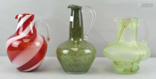 Three Studio glass water jugs, to include : Clouded, candy cane swirl and bubble control designs,