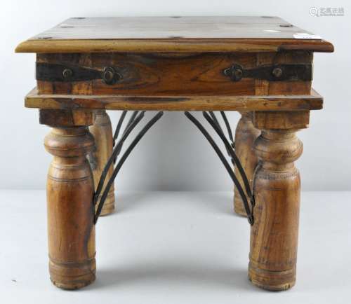An Indian wooden side table,