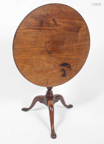 An 18th century tripod table,