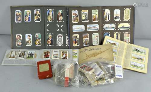 A box of cigarette cards and albums and with some tea cards