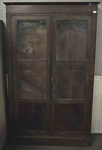 A mahogany veneered two door bookcase with solid panel base with two glazed sections above,