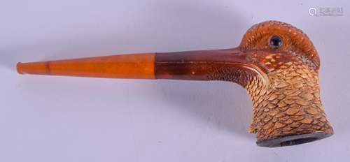 A RARE 19TH CENTURY CARVED MEERSCHAUM AND AMBER PIPE formed as a wood pecker. 17 cm wide.