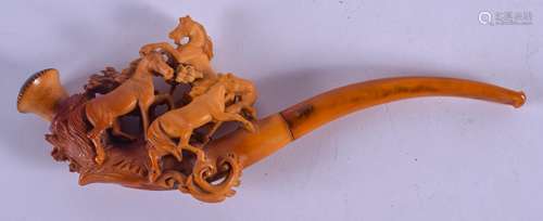 A 19TH CENTURY CARVED MEERSCHAUM AND AMBER PIPE formed as three roaming horses. 18 cm wide.