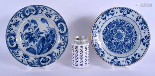 TWO 18TH CENTURY DUTCH DELFT BLUE AND WHITE POTTERY PLATES painted with flowers and motifs. 22 cm di