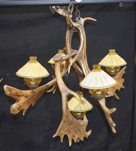 A LARGE 19TH CENTURY BAVARIAN BLACK FOREST ANTLER HORN CHANDELIER of naturalistic form. 50 cm x 54 c