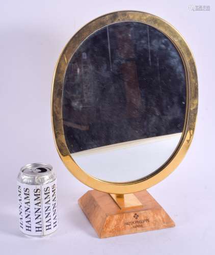 A STYLISH SWISS PATEK PHILIPPE 1960S GOLD PLATED MIRROR upon a burr veneered square form canted base