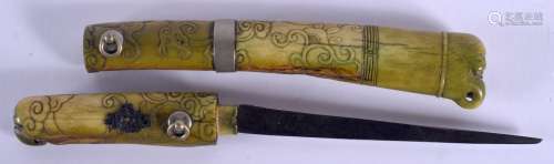 A RARE 18TH CENTURY CHINESE STAINED IVORY CASED KNIFE Qianlong, decorated with roaming chilong and c