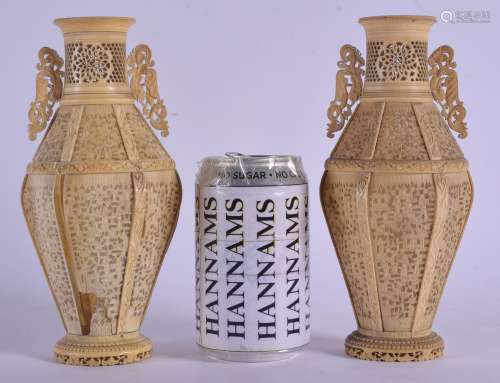 A PAIR OF 19TH CENTURY CHINESE TWIN HANDLED IVORY VASES Qing, decorated with figures in various purs