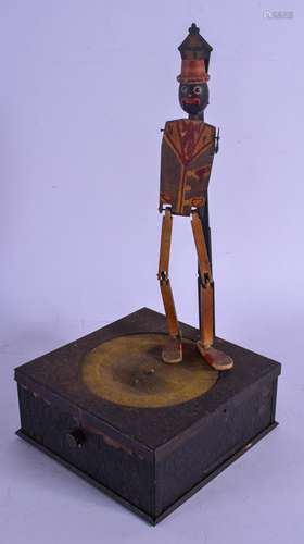 A RARE 1920S TIN DANCING MAN SPEAKER formed with a square box upon a lamp post. 31 cm high.