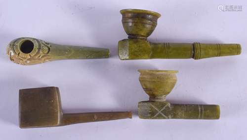 FOUR UNUSUAL EARLY 20TH CENTURY CONTINENTAL HARDSTONE PIPES in various forms and sizes. Largest 12.5