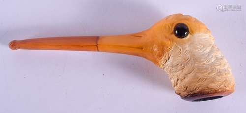 A RARE 19TH CENTURY CARVED MEERSCHAUM AND AMBER PIPE formed as a wood pecker. 16 cm wide.