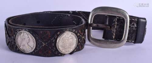 AN EARLY 20TH CENTURY CONTINENTAL LEATHER BELT set with eight 18th century Austrian thaler coins. 12