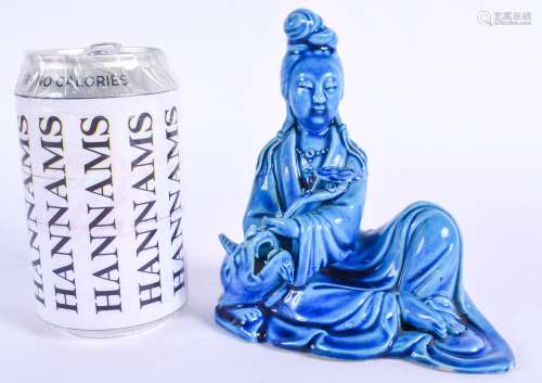 A 19TH CENTURY CHINESE BLUE GLAZED PORCELAIN FIGURE OF GUANYIN Late Qing, modelled holding a rui sce