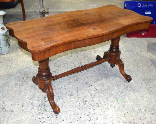 A VICTORIAN ROSEWOOD SOFA TABLE with scrolling supports. 137 cm x 68 cm x 74 cm.