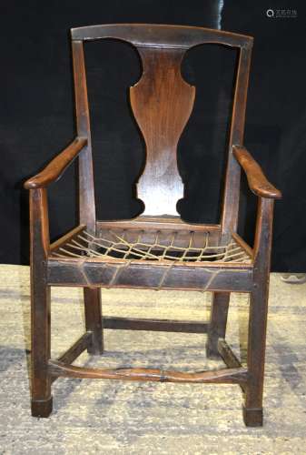 A GEORGE II CARVED WOOD SINGLE DINING CHAIR with shaped backsplat and tactile scrolling front suppor