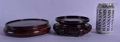TWO 19TH CENTURY CHINESE CARVED HONGMU HARDWOOD STANDS Qing, one with openwork foot. Largest 18 cm d