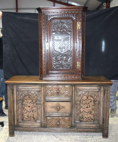 AN OAK TUDOR STYLE BUFFET with matching stool, desk stand and similar hanging oak corner cupboard. B