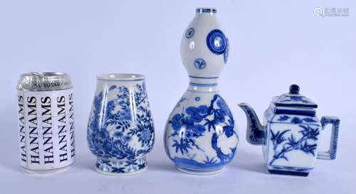 A 19TH CENTURY JAPANESE MEIJI PERIOD BLUE AND WHITE SAKE BOTTLE together with two others. Largest 22