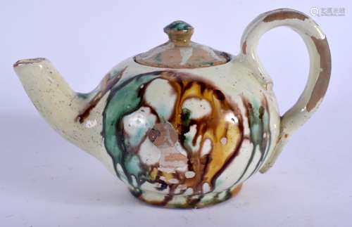 AN UNUSUAL CONTINENTAL WHIELDON TYPE SANCAI TYPE POTTERY TEAPOT AND COVER. 15 cm wide.