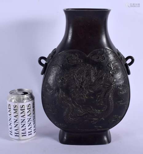 A 19TH CENTURY JAPANESE MEIJI PERIOD BRONZE PILGRIM MOON FLASK decorated with a dragon clutching a f