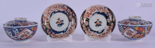 A PAIR OF 19TH CENTURY JAPANESE MEIJI PERIOD IMARI BOWLS AND COVERS painted with floral sprays. 10 c