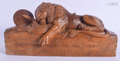 A 19TH CENTURY CONTINENTAL CARVED FRUIT WOOD FIGURE OF THE LUCERNE LION modelled resting upon armour