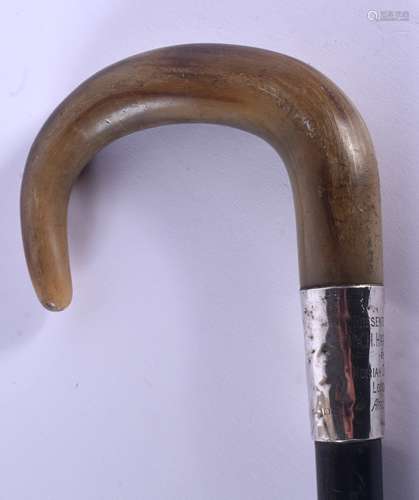 A 19TH CENTURY CONTINENTAL CARVED RHINOCEROS HORN WALKING CANE with silver mounts. 88 cm long.