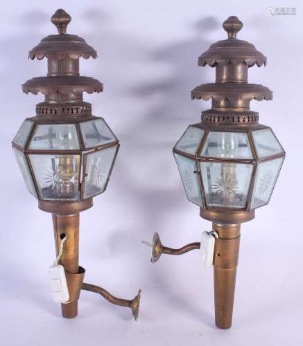 A PAIR OF REGENCY STYLE BRASS AND STAR GLASS LANTERNS of hexagonal form. 55 cm long.