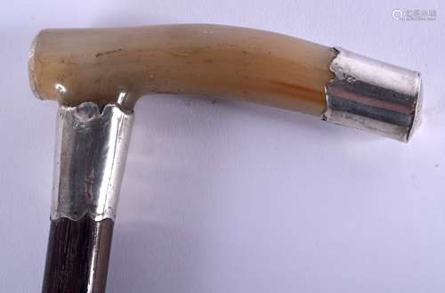 A 19TH CENTURY CONTINENTAL CARVED BUFFALO HORN WALKING CANE with silver mounts. 88 cm long.