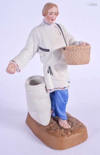 A 19TH CENTURY RUSSIAN BISQUE PORCELAIN FIGURE OF A FARMER Attributed to the Gardner factory, modell