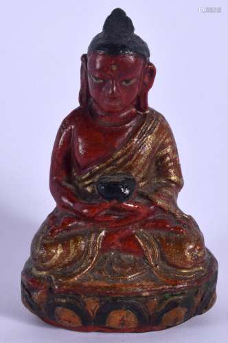 AN 18TH CENTURY SOUTH EAST ASIAN PAINTED LACQUER POTTERY BUDDHA modelled holding a censer upon a lot