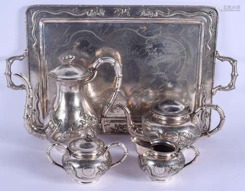 A LARGE 19TH CENTURY CHINESE EXPORT FIVE PIECE SILVER TEASET ON TRAY decorated with dragons upon a t