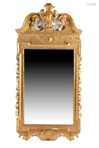 A GEORGE II GILTWOOD WALL MIRROR C.1730 the later …