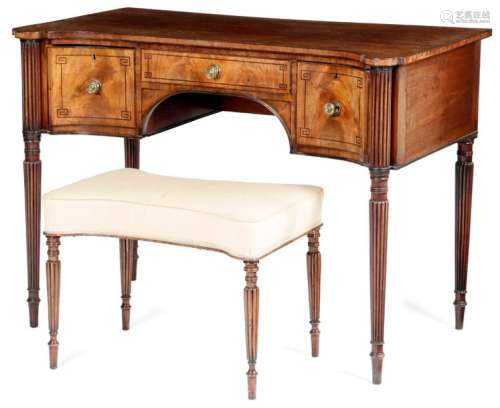 A LATE REGENCY MAHOGANY DRESSING TABLE IN THE MANN…
