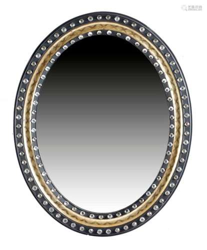 AN IRISH EBONISED AND GILT OVAL WALL MIRROR SECOND…