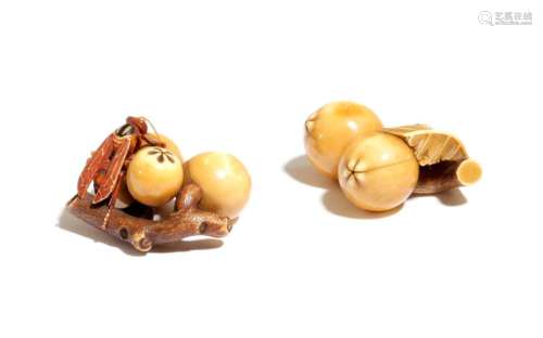 Λ TWO JAPANESE IVORY NETSUKE OF FRUITING BRANCHES …