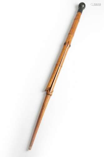 A FISHERMAN'S WALKING CANE C.1900 with a patinated…