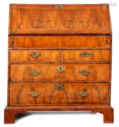 A GEORGE I WALNUT BUREAU C.1715 with cross and fea…