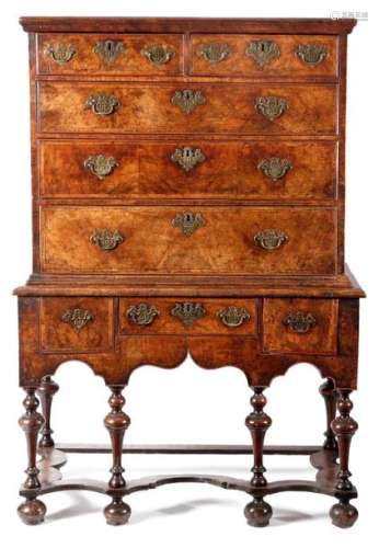 A QUEEN ANNE WALNUT CHEST ON STAND C.1710 with two…