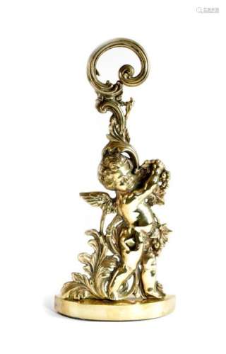 A BRASS BACCHANALIAN CHERUB DOORSTOP BY PEERAGE, E…