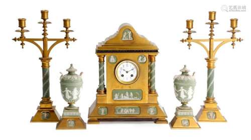 A GILT BRASS AND WEDGWOOD POTTERY MOUNTED CLOCK GA…