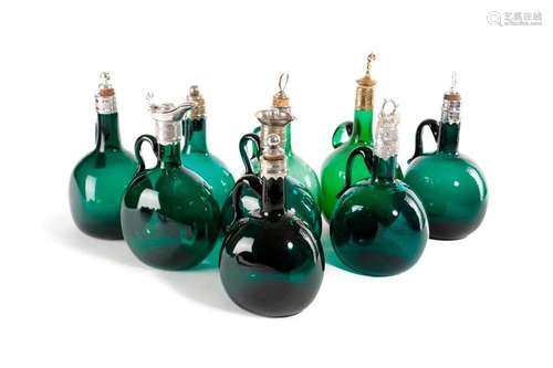 A COLLECTION OF GREEN GLASS SPIRIT DECANTERS 19TH …