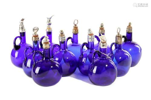 A COLLECTION OF BRISTOL BLUE GLASS SPIRIT DECANTER…