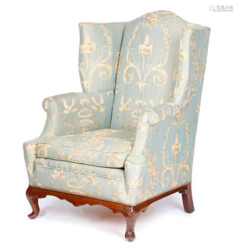 A WING ARMCHAIR IN GEORGE II STYLE FIRST HALF 20TH…