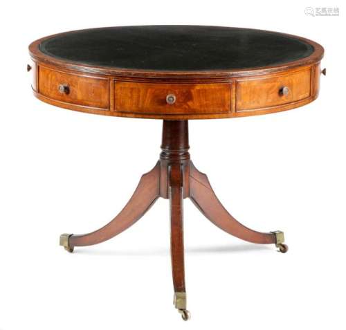 A MAHOGANY LIBRARY DRUM TABLE IN REGENCY STYLE FIR…