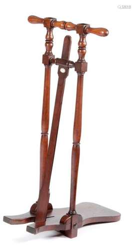 A MAHOGANY BOOT JACK with a turned handle and supp…