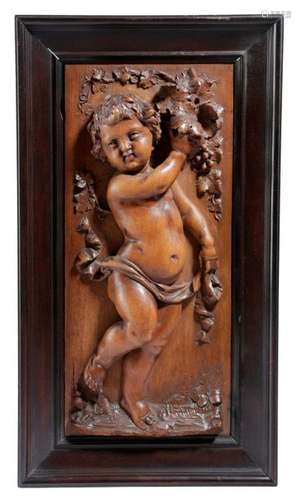 AN ITALIAN CARVED WALNUT CHERUB PANEL FLORENCE, C.…