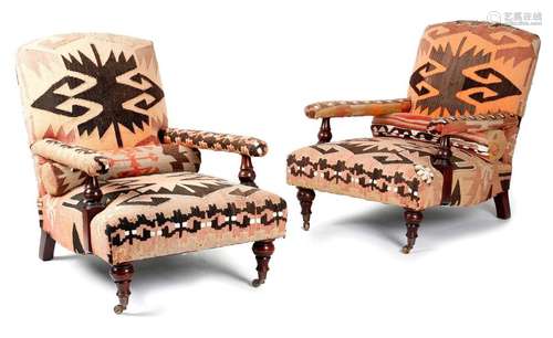 A PAIR OF EASY ARMCHAIRS IN HOWARD STYLE BY GEORGE…