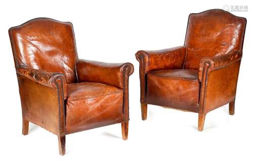 A PAIR OF BROWN LEATHER EASY ARMCHAIRS FIRST HALF …