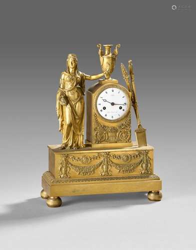 Pendule en bronze doré représentant une femme cour…